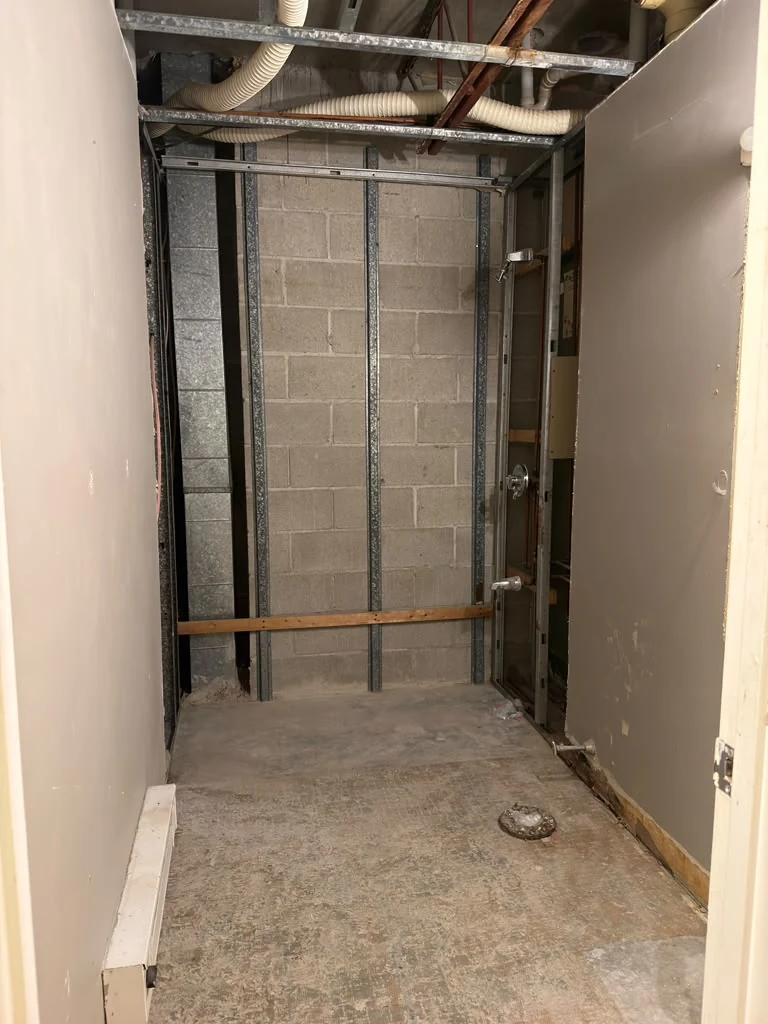 An interior demolition project with existing finishes removed